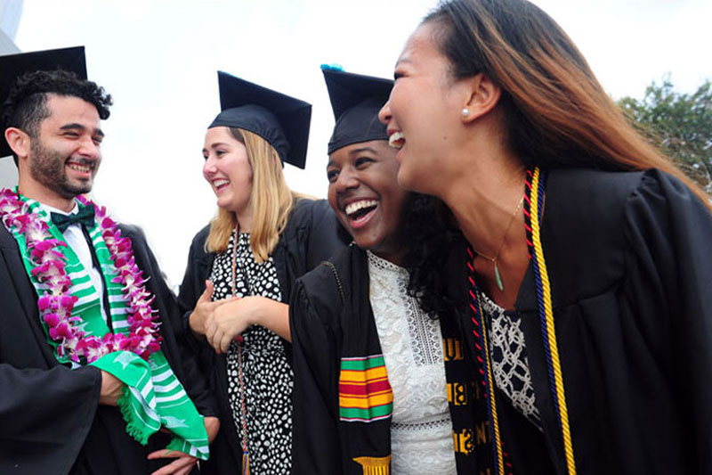 Four grads celebrate together at Commencement