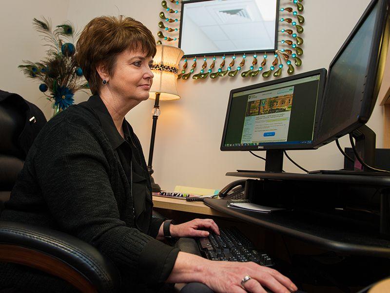 Kelly Bankston, assistant director of employment, works at her computer