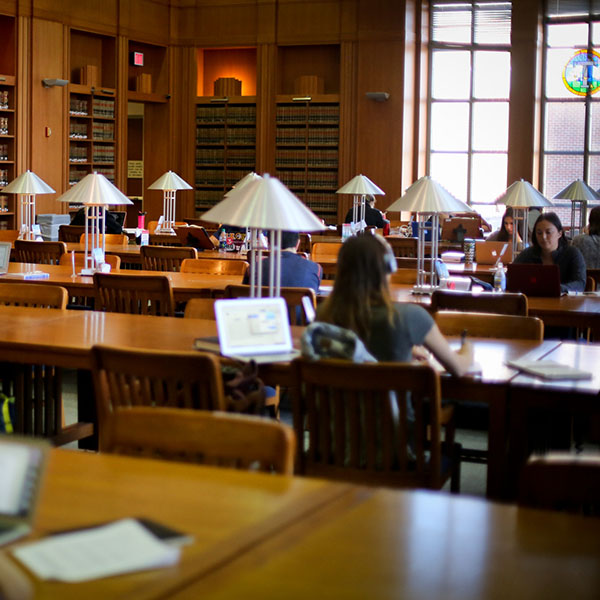 Students working at tables in the Law School study room