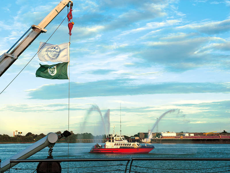 A U.S. Coast Guard fireboat puts on a water display during the dedicaiton of the Tulane River and Coastal Center.
