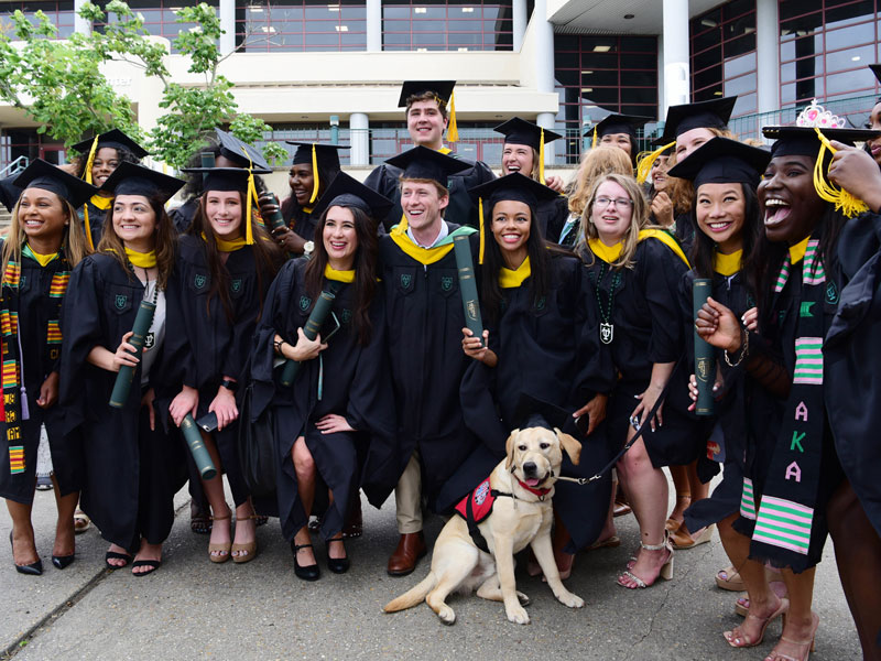 Grads celebrate and pose for photo on Commencement day