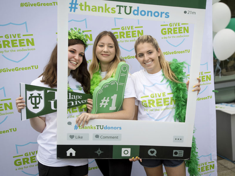 Students pose for photo during Give Green event
