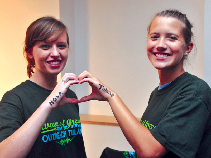 A pair of students creates a heart with their hands, representing Tulane's love of New Orleans