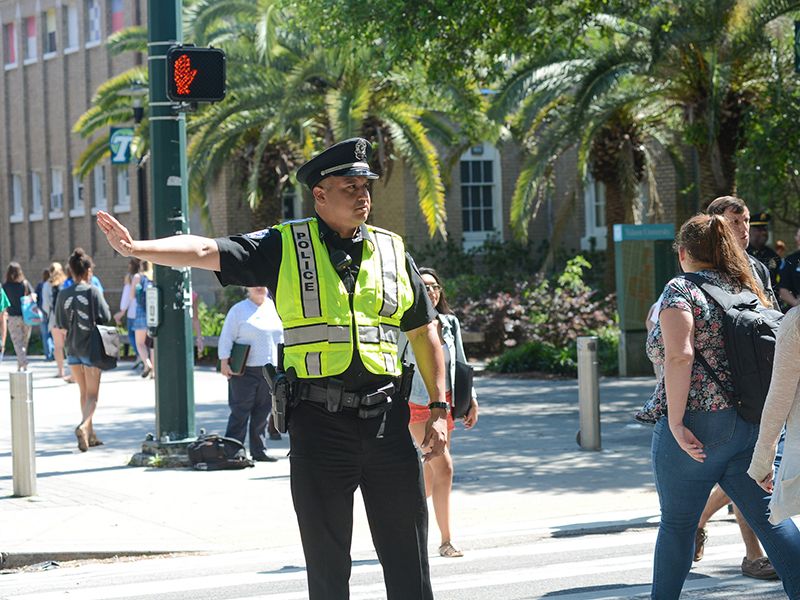 Tulane police officer directs traffic on campus