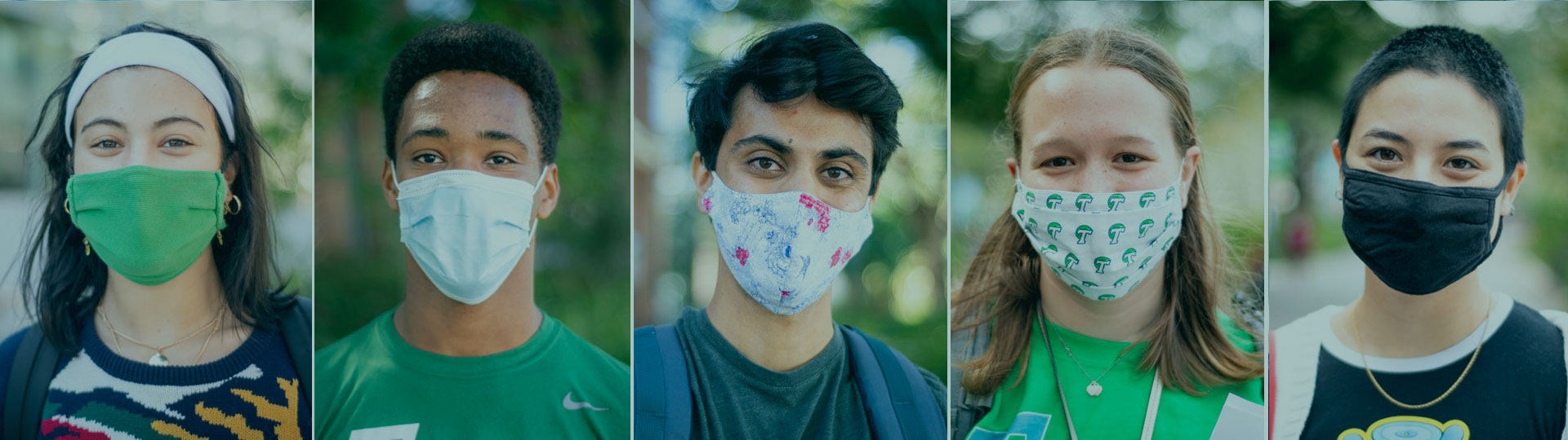 Five students wearing masks on Tulane campus