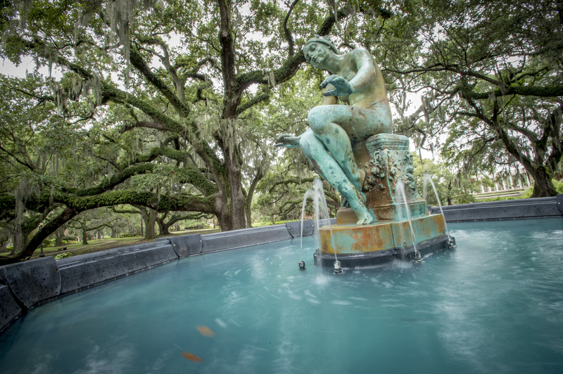 A fountain and sculpture of a water nymph in City park