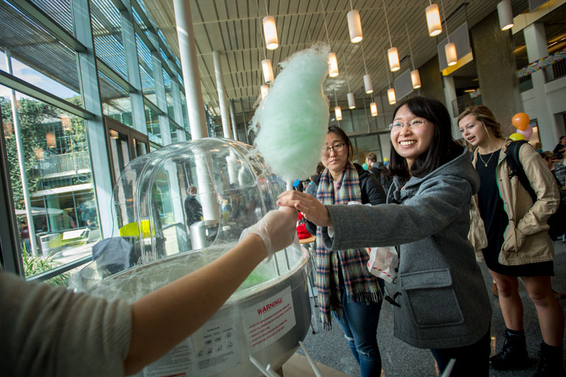 Students enjoy cotton candy at the LBC Birthday Party event