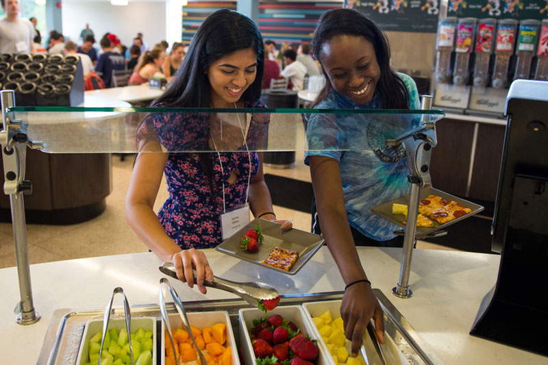 Students at food station in Bruff Commons