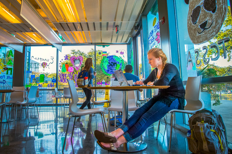 Student studies at a table in the LBC