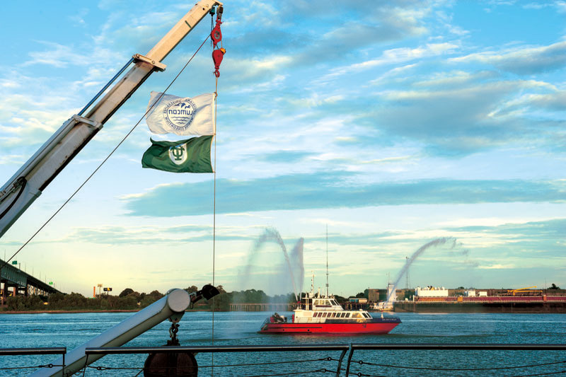 A U.S. Coast Guard fireboat puts on a water display during the dedicaiton of the Tulane River and Coastal Center