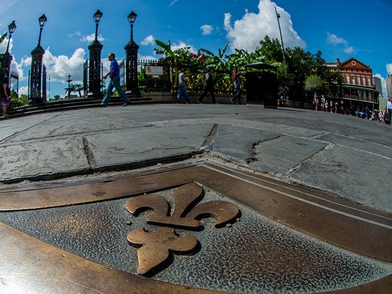 The fence and sidewalk outside of Jackson Square