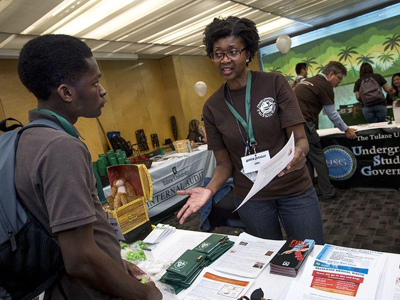 A team member speaking to student at Risk Safety Summit