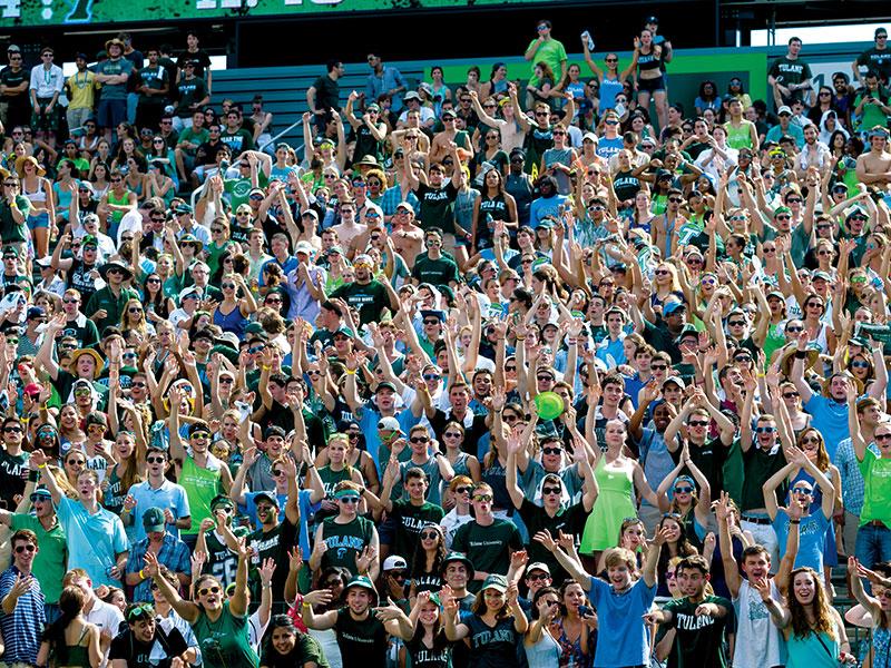 Students cheer on the Green Wave football team in Yulman Stadium