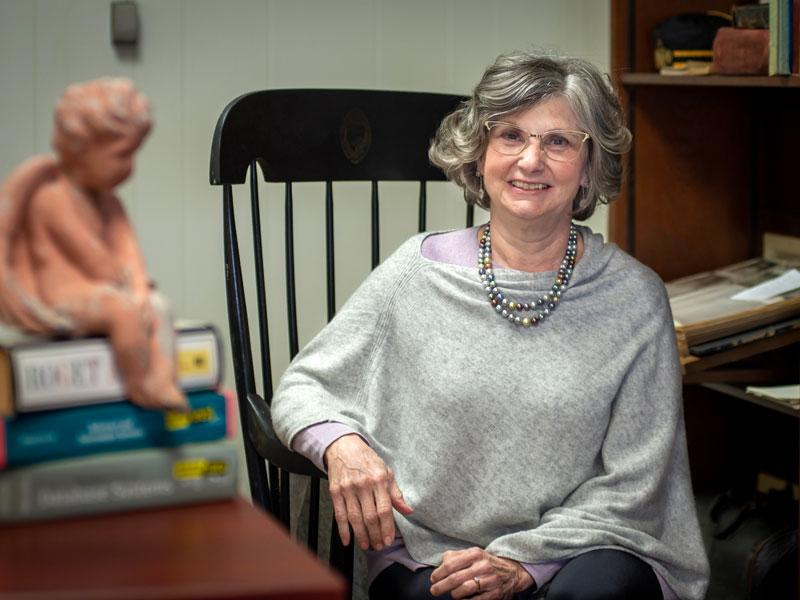 Elaine Hicks seated in her office